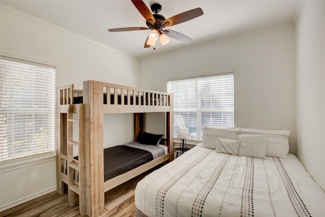 4880 Beach View Dr, Malakoff, TX 75148 - bedroom featuring crown molding, a ceiling fan, baseboards, and wood finished floors