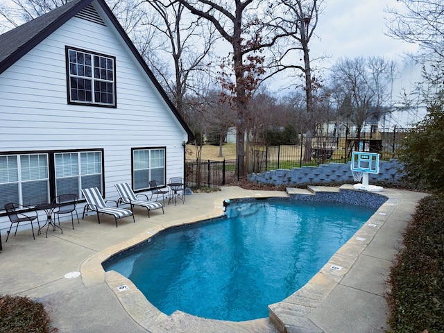 view of pool featuring a fenced in pool, a patio, and fence