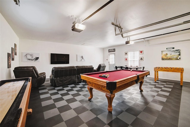 game room featuring pool table, a garage, and dark colored carpet