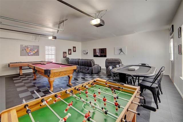 playroom featuring pool table and a garage