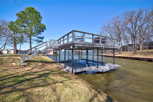 dock area with stairway and a deck with water view