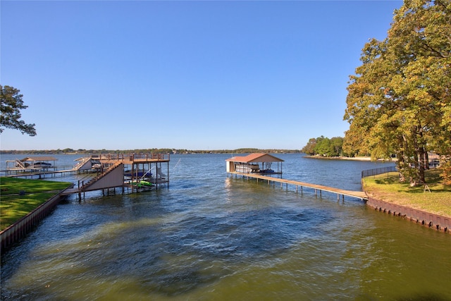 view of dock with boat lift and a water view