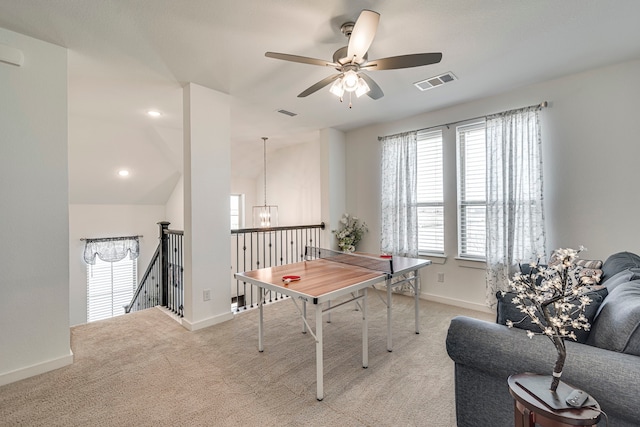 game room featuring visible vents, baseboards, light colored carpet, and ceiling fan with notable chandelier