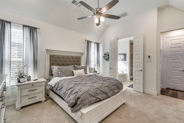 bedroom featuring light carpet, visible vents, and vaulted ceiling