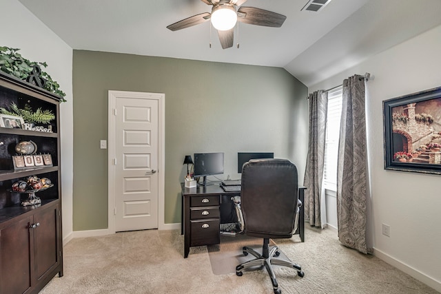 office with baseboards, visible vents, lofted ceiling, ceiling fan, and light carpet