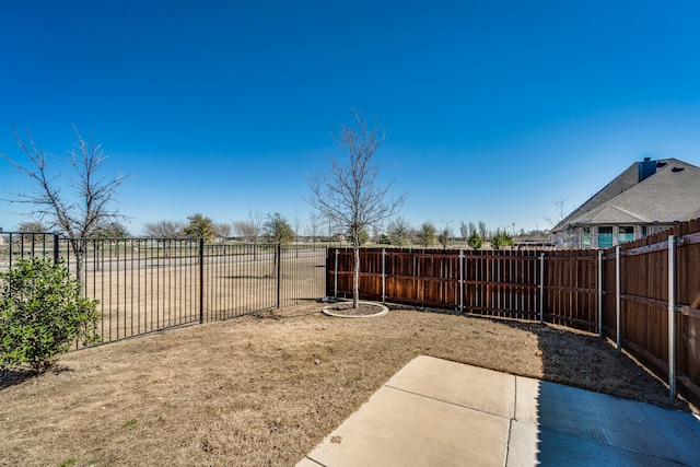 view of yard with a fenced backyard