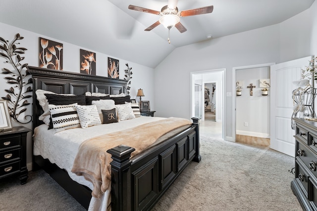 bedroom with baseboards, light colored carpet, a ceiling fan, and vaulted ceiling