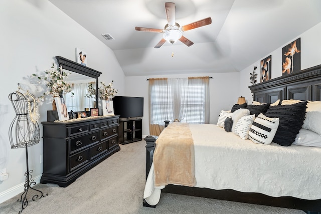 bedroom with visible vents, baseboards, lofted ceiling, ceiling fan, and light colored carpet