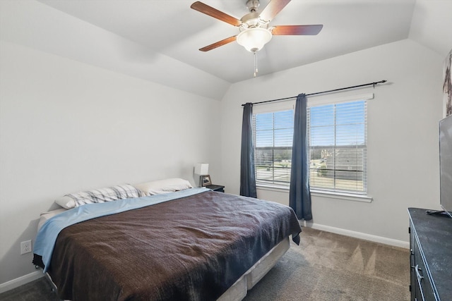 bedroom with lofted ceiling, carpet flooring, a ceiling fan, and baseboards