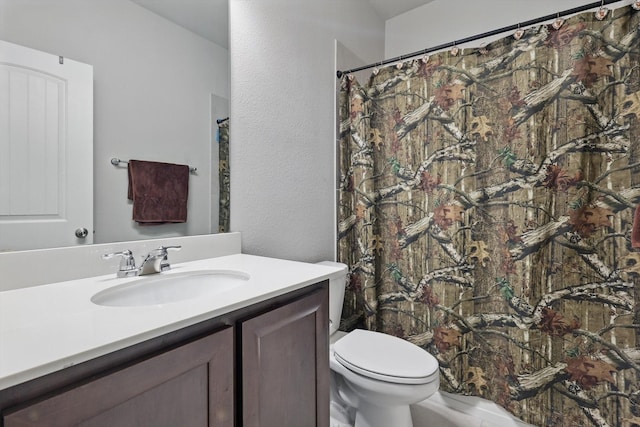 full bathroom featuring toilet and vanity