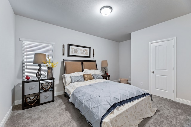 carpeted bedroom featuring baseboards