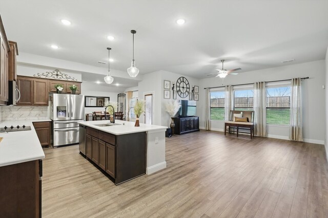 623 Woodridge Dr, Oak Point, TX 75068 - kitchen with appliances with stainless steel finishes, a sink, light countertops, ceiling fan, and recessed lighting