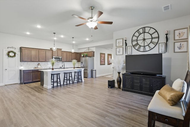 623 Woodridge Dr, Oak Point, TX 75068 - living room featuring a ceiling fan, light wood finished floors, baseboards, and recessed lighting