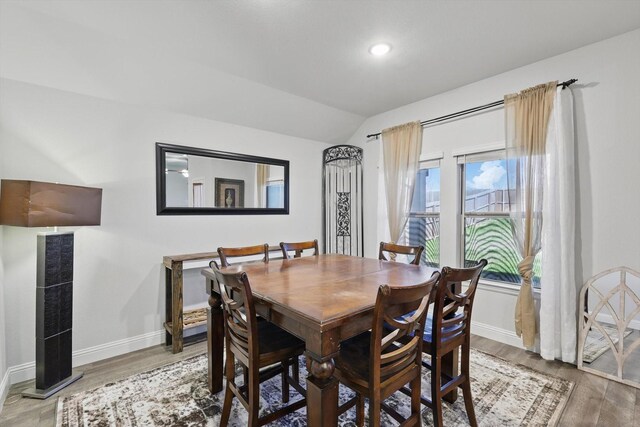 623 Woodridge Dr, Oak Point, TX 75068 - dining space featuring baseboards, wood finished floors, lofted ceiling, and recessed lighting