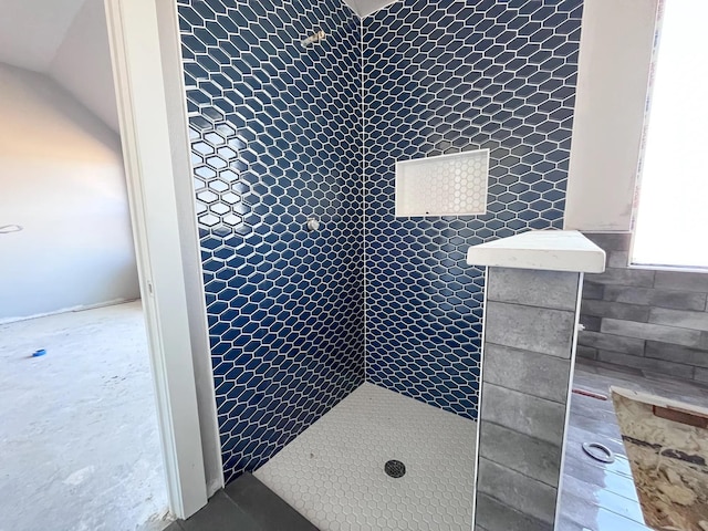 bathroom with tiled shower