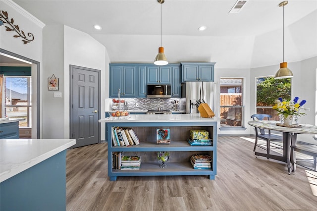 kitchen featuring visible vents, stainless steel appliances, blue cabinets, and open shelves