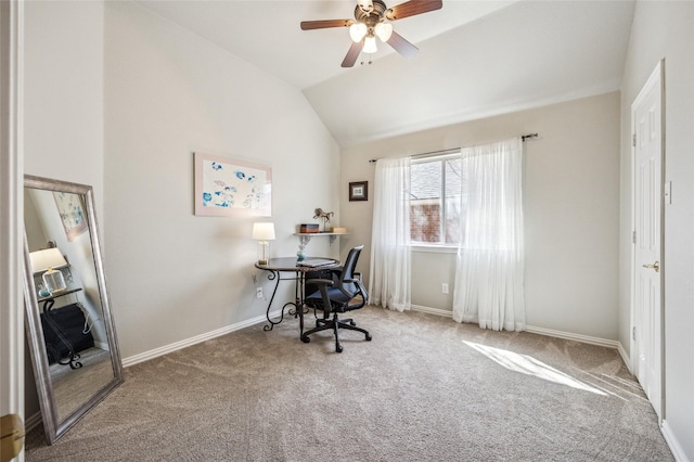 office space with vaulted ceiling, carpet, baseboards, and ceiling fan