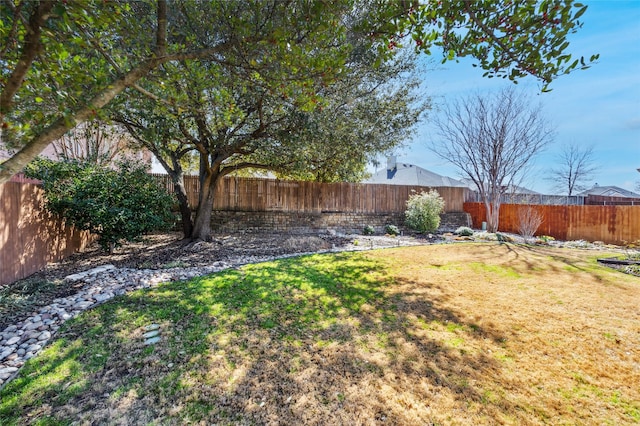 view of yard with a fenced backyard