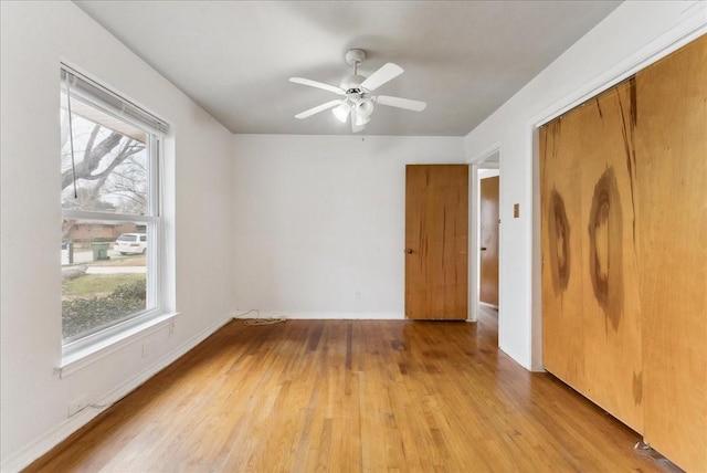 3105 Marydale Rd, Garland, TX 75041 - empty room with baseboards, light wood-style flooring, and a ceiling fan