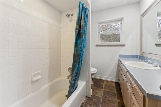 3105 Marydale Rd, Garland, TX 75041 - bathroom featuring baseboards, shower / tub combo, toilet, and vanity