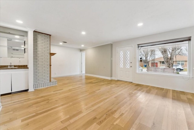 3105 Marydale Rd, Garland, TX 75041 - unfurnished living room with light wood finished floors, recessed lighting, and baseboards