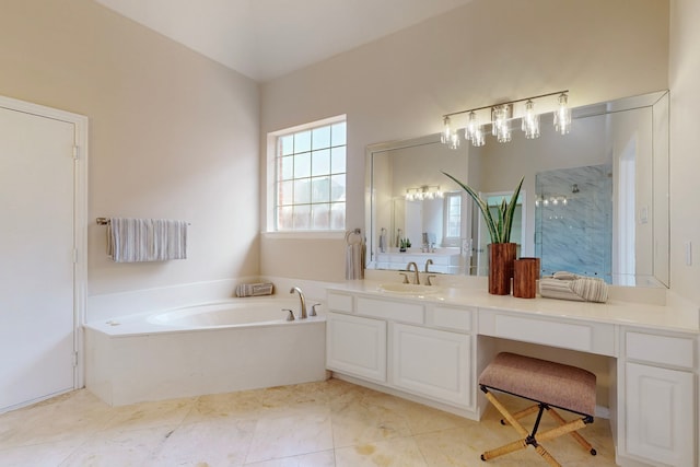 full bathroom featuring vanity, a garden tub, and a shower with shower door