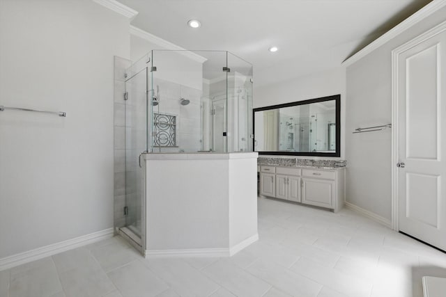 full bathroom featuring vanity, a shower stall, recessed lighting, and baseboards