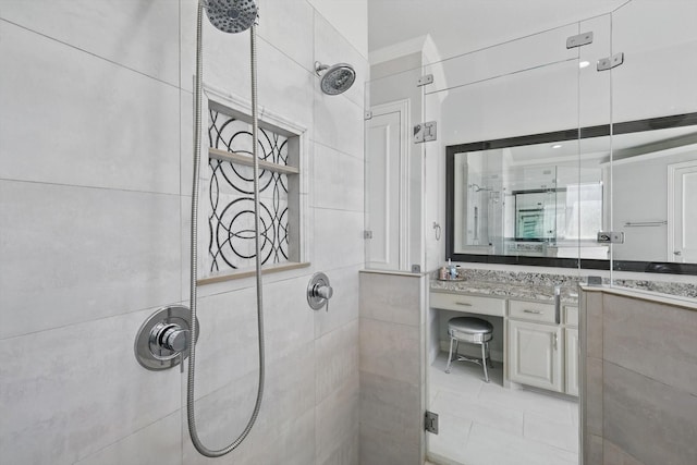 full bath featuring vanity and a stall shower