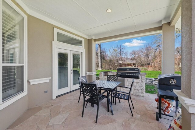 5833 Forest River Dr, Fort Worth, TX 76112 - view of patio / terrace with french doors, fence, outdoor dining area, and ceiling fan