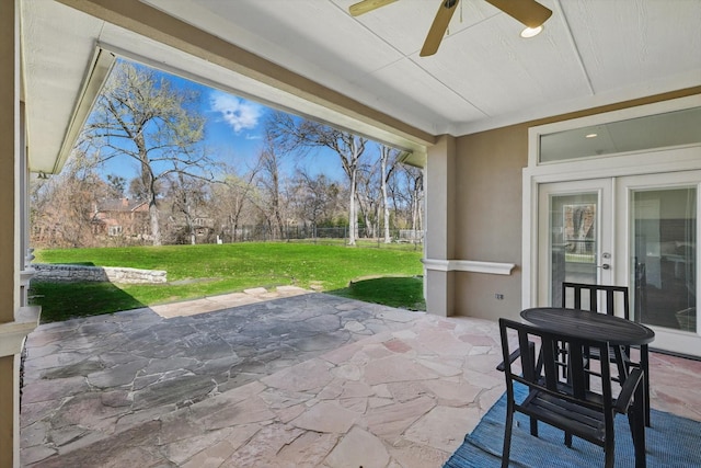 view of patio featuring ceiling fan