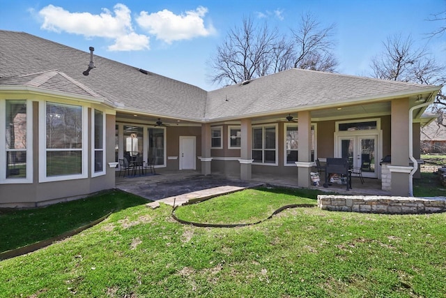 rear view of house featuring french doors, a patio, ceiling fan, and a shingled roof