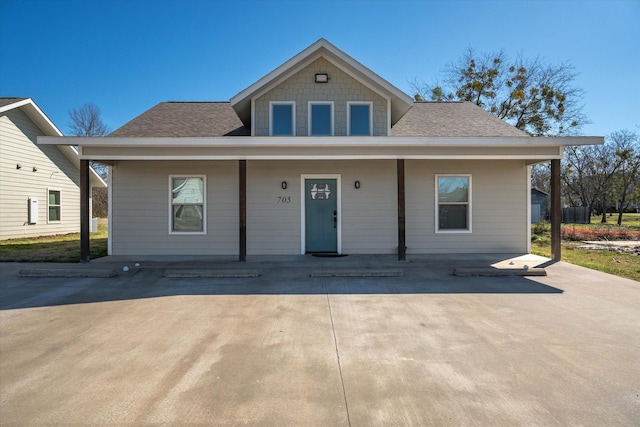 bungalow-style house featuring roof with shingles