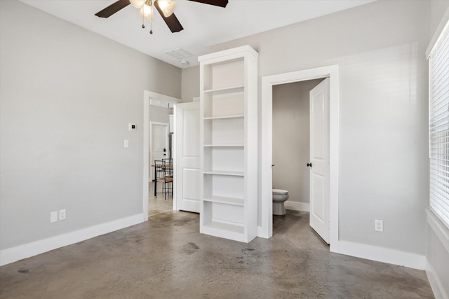 unfurnished bedroom with visible vents, concrete flooring, and baseboards