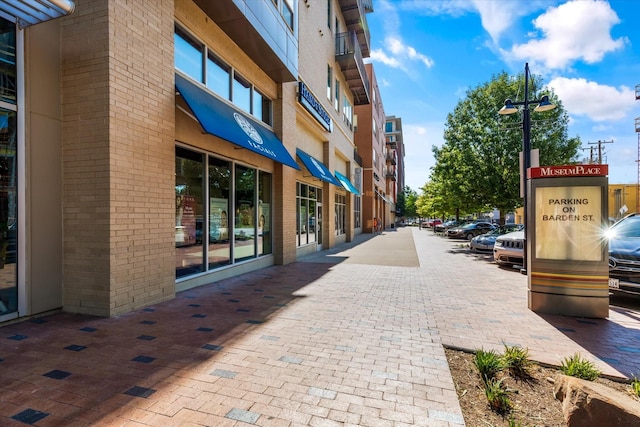 view of building exterior featuring uncovered parking