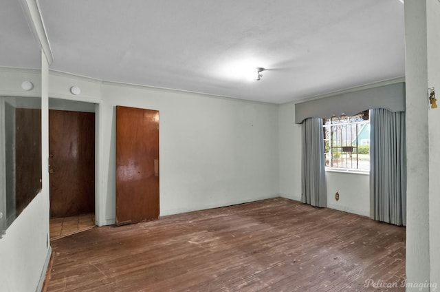 unfurnished room with hardwood / wood-style floors