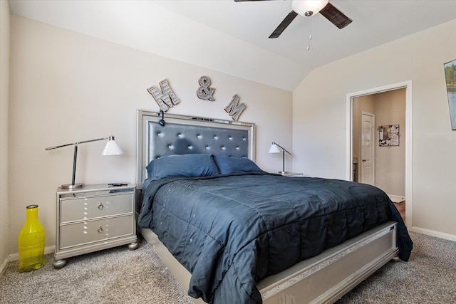 bedroom with baseboards, vaulted ceiling, carpet flooring, ensuite bathroom, and a ceiling fan