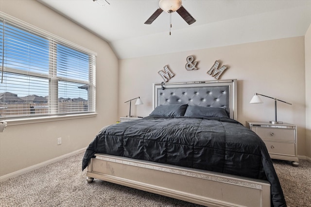 carpeted bedroom with baseboards, lofted ceiling, and a ceiling fan