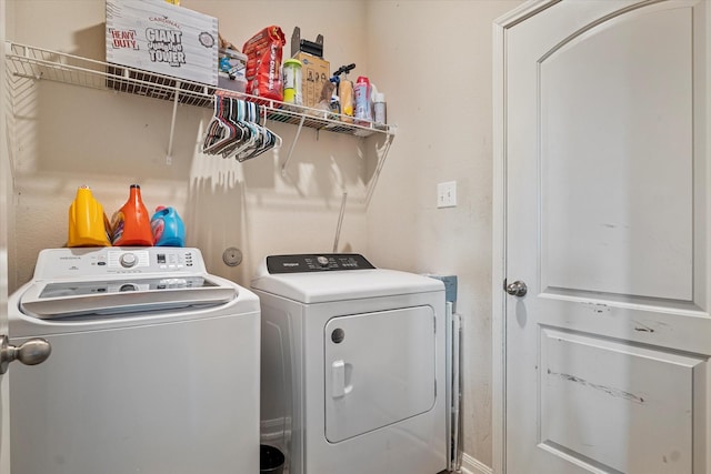 washroom featuring washer and dryer and laundry area