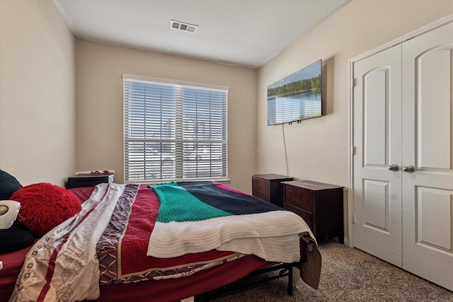 carpeted bedroom with visible vents