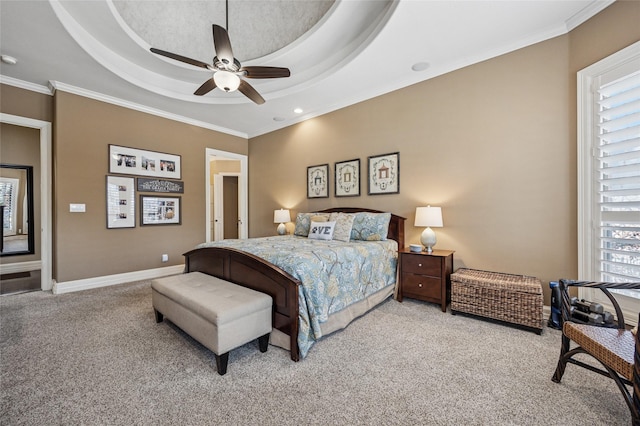 bedroom featuring baseboards, ceiling fan, ornamental molding, light carpet, and a raised ceiling