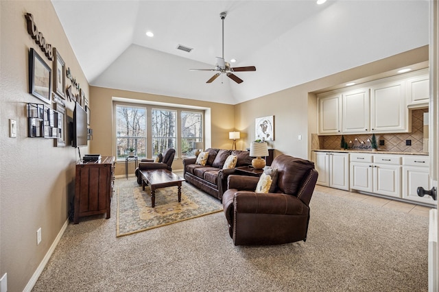 living area with baseboards, visible vents, lofted ceiling, recessed lighting, and light colored carpet