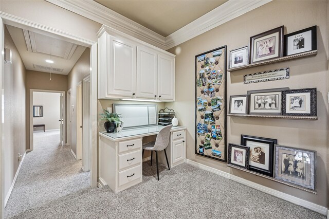 office space with visible vents, baseboards, light colored carpet, and attic access