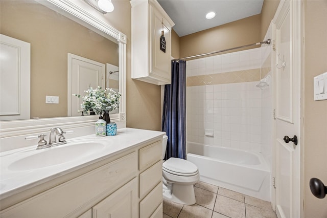 bathroom with vanity, tile patterned floors, toilet, and shower / tub combo with curtain