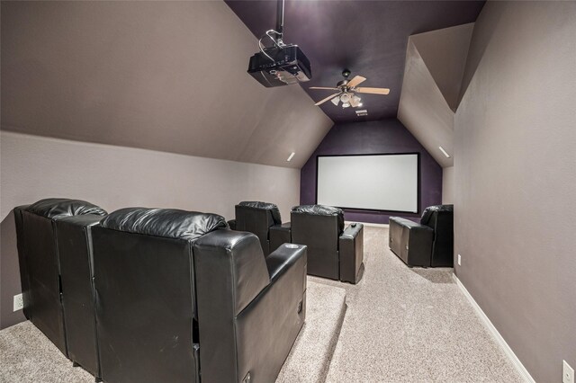 home theater room with baseboards, lofted ceiling, a ceiling fan, and carpet flooring