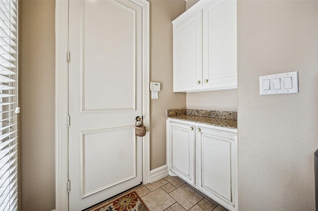 interior space featuring light tile patterned floors