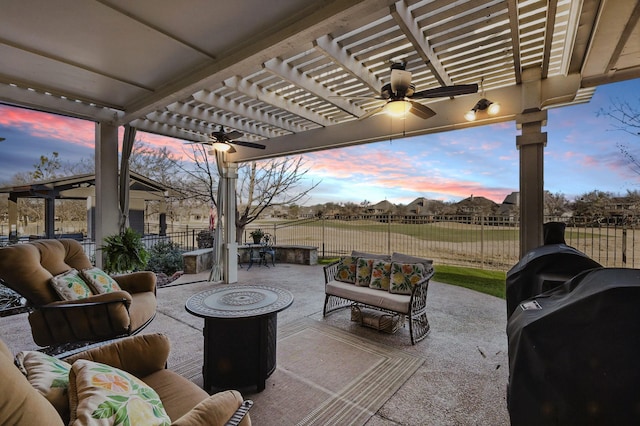 view of patio / terrace featuring area for grilling, a ceiling fan, a pergola, an outdoor living space, and a fenced backyard