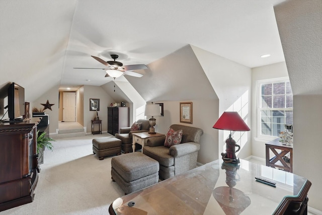 living room featuring vaulted ceiling, carpet floors, and ceiling fan