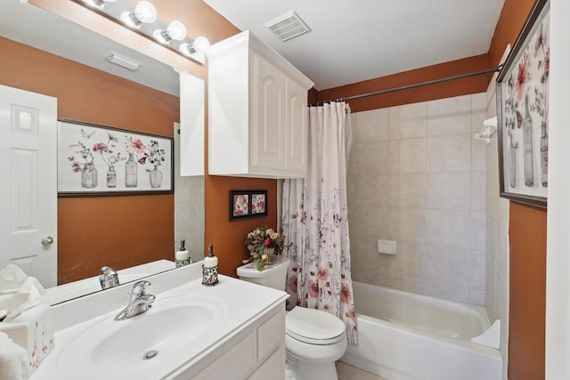 bathroom featuring visible vents, toilet, vanity, and shower / tub combo