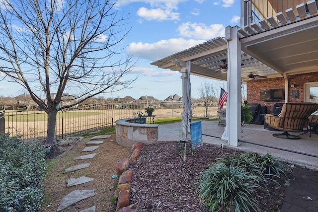 view of yard with a pergola, a patio area, fence, and ceiling fan