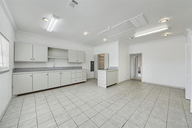 kitchen with open shelves, light countertops, visible vents, and ornamental molding